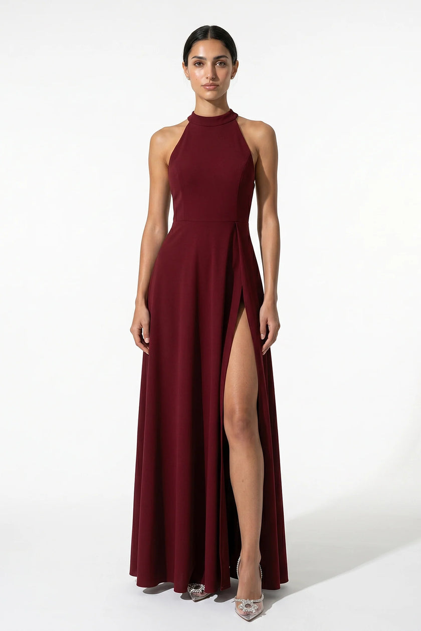 Red FJØRNA sleeveless maxi dress for women with high neck, A-line silhouette, and side slit, perfect for elegant occasions.