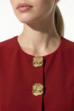 Women's sleeveless waistcoat by FJØRNA with metal buttons, deep red color, tailored fit, and detailed front design.