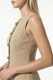 FJØRNA women's sleeveless khaki waistcoat with tailored fit and metal button details, showcasing front view and stylish design.