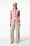 Women's pink sleeveless waistcoat by FJØRNA with tailored fit and metal button details, shown from the full front view.