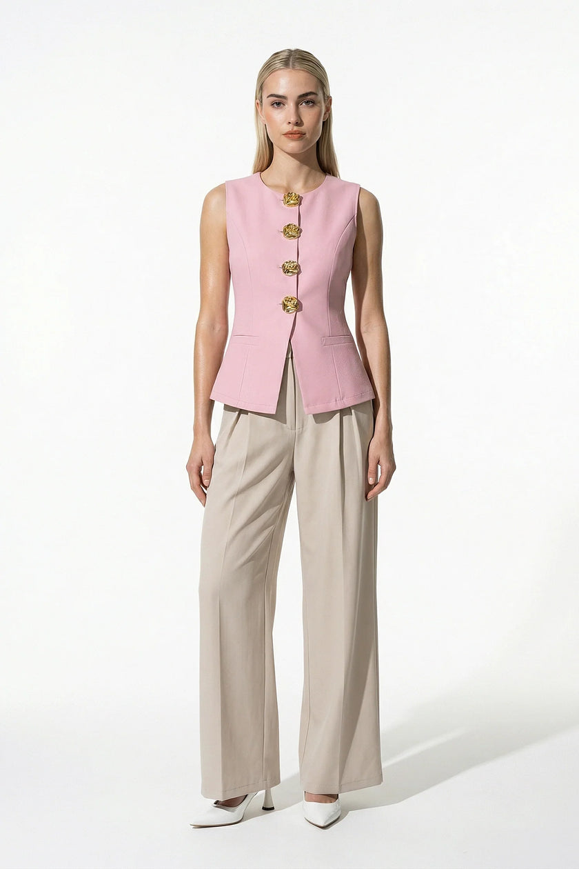 Women's pink sleeveless waistcoat by FJØRNA with tailored fit and metal button details, shown from the full front view.