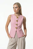 Pink sleeveless women's waistcoat by FJØRNA with tailored fit and metal button details, perfect for stylish layered looks.