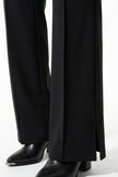 Black FJØRNA women's slim fit co-ord set with long sleeve top and wide-leg trousers, styled for a sleek, modern look.