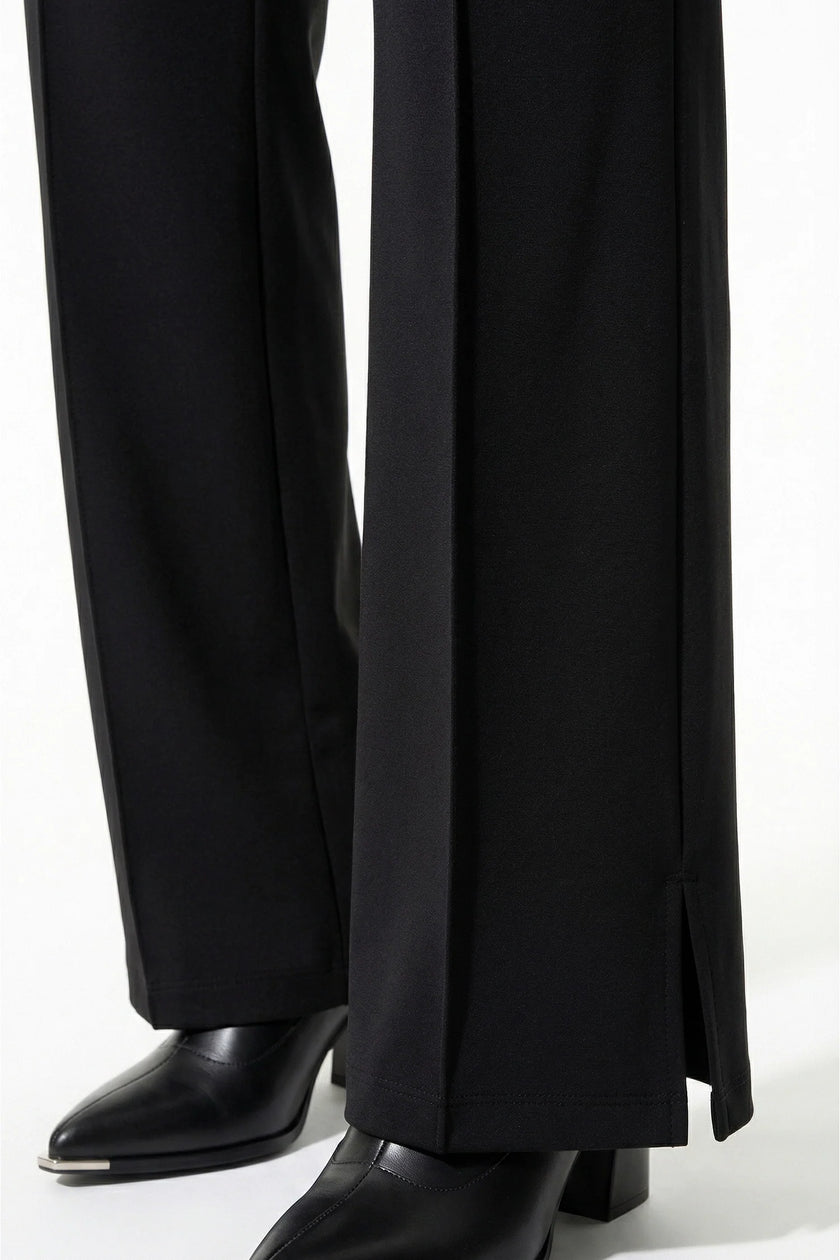 Black FJØRNA women's slim fit co-ord set with long sleeve top and wide-leg trousers, styled for a sleek, modern look.
