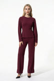 FJØRNA women's slim fit co-ord set with long sleeve top and wide leg trousers in wine red, full-body view.