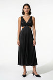 Black FJØRNA women's pleated maxi dress with V-neck, suspender straps, and hollow waist detail.