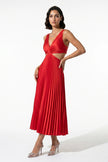 Red FJØRNA women's pleated maxi dress with V-neck, suspender straps, and hollow waist, full-body view.