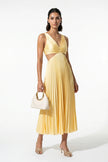 Yellow FJØRNA women's pleated maxi dress with V-neck, suspender straps, and hollow waist, full-body view.