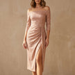 Champagne off-shoulder ruched knit midi dress with a high slit, stylish and elegant FJØRNA midi dress displayed on a model.