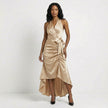 FJØRNA satin halter neck wrap maxi dress in champagne with ruffled hem and bow tie waist, elegant evening wear.