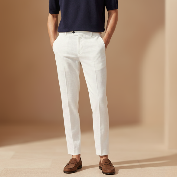 Relaxed fit linen trousers for men by FJØRNA, showing lightweight, breathable fabric and classic tailored design.