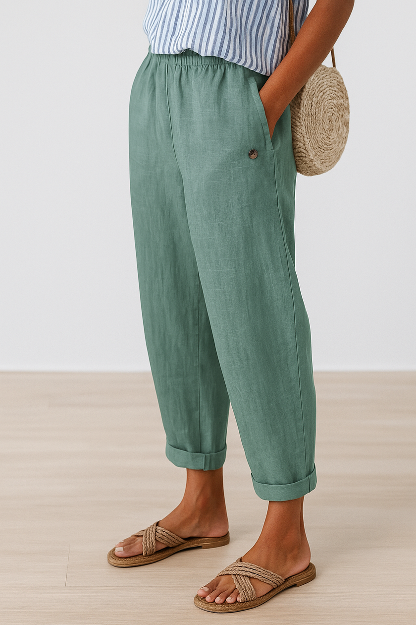 FJØRNA lightweight summer trousers for women with straight legs, breathable fabric and functional pockets, ideal for warm weather.