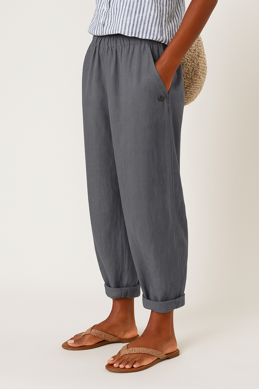 FJØRNA lightweight women's summer trousers with straight leg design, breathable fabric, and front pockets, perfect for warm weather.