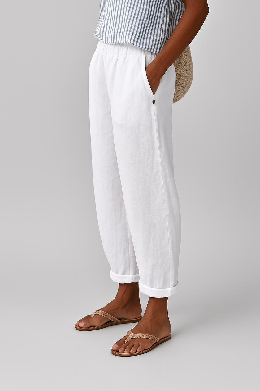 Lightweight women's summer trousers by FJØRNA featuring straight leg design, breathable fabric, and side pockets.