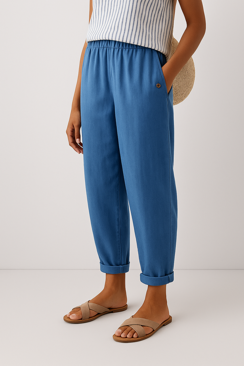Lightweight FJØRNA women's summer trousers with straight legs, breathable fabric, and side pockets for casual comfort.