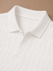 Men's luxury knit polo shirt by FJØRNA featuring soft textured fabric, perfect for summer casual wear.
