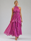 FJØRNA elegant women's maxi dress with halter neck and ruffle details, flowing fabric and stylish design for special occasions.