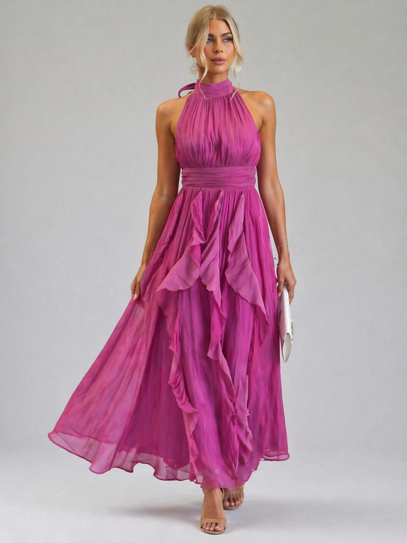 FJØRNA elegant women's maxi dress with halter neck and ruffle details, flowing fabric and stylish design for special occasions.