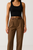 Women’s wool wide-leg trousers by FJØRNA featuring high waist and tailored fit, shown on a model.