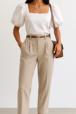 Women's wide-leg wool trousers by FJØRNA featuring high waist and tailored fit, shown on a model.