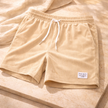 Men's FJØRNA corduroy shorts with drawstring waist, casual pants featuring a textured fabric and relaxed fit.
