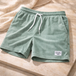 Men's corduroy shorts with drawstring waist from FJØRNA, featuring a casual fit and textured fabric.