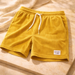 FJØRNA men's corduroy shorts with drawstring waist, casual pants featuring textured fabric and relaxed fit.