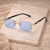 Unisex retro sunglasses by FJØRNA featuring rounded frames and tinted lenses, stylish accessories for men.