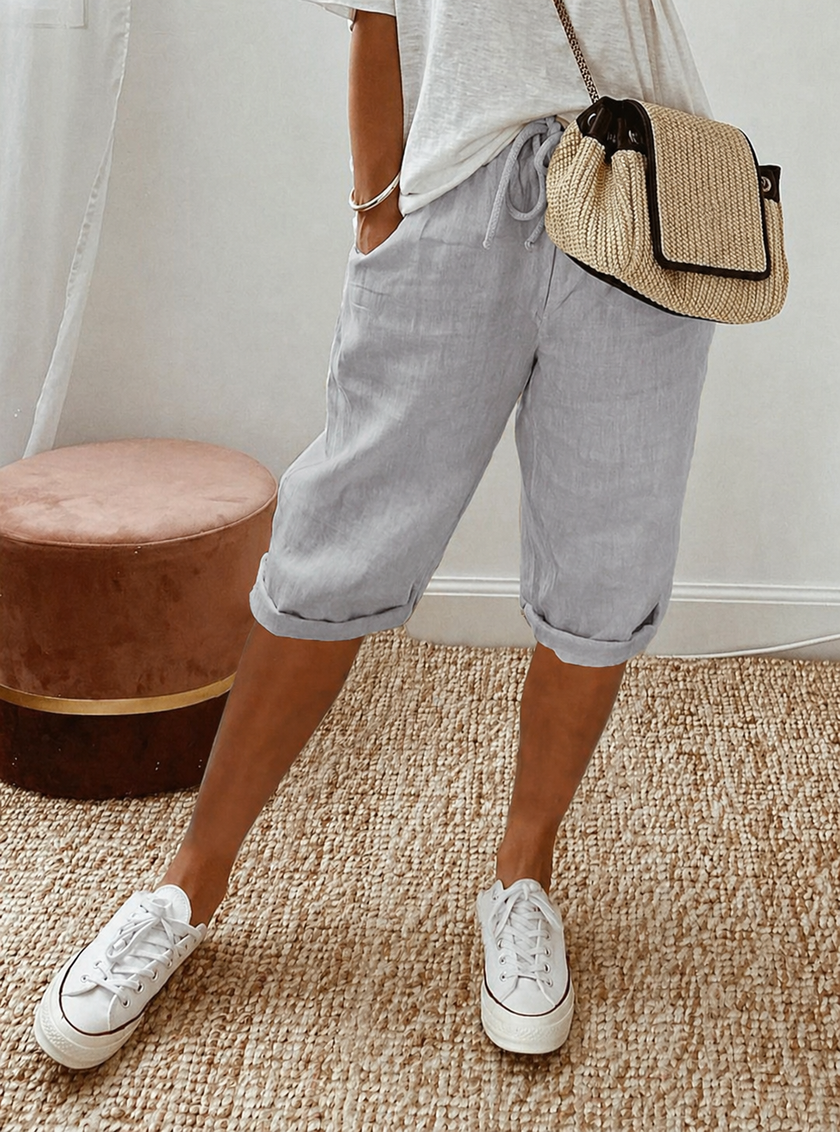FJØRNA women's lightweight summer Capri pants with relaxed fit, drawstring waist, and breathable fabric for comfortable wear.