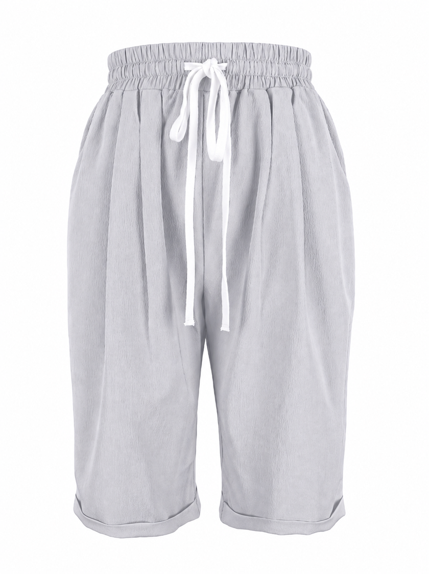 FJØRNA lightweight summer women's capri pants with relaxed fit, drawstring waist, and breathable fabric, ideal for warm weather.
