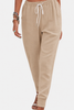 FJØRNA Tara women's jogger pants with drawstring waist and elastic ankle cuffs, comfortable casual activewear in a relaxed fit.