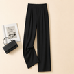 FJØRNA women's lightweight summer trousers with high waist and wide-leg design, made from breathable fabric for comfort.