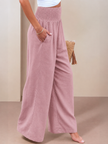 FJØRNA linen summer trousers for women, high waist wide-leg style with drawstring, light and breathable for warm weather.