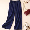 FJØRNA lightweight women's summer trousers with relaxed fit, drawstring waist, and pocket details, perfect for warm weather.
