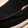 FJØRNA men's suede slip-on loafers showing sleek design and soft suede material on a neutral background.