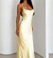 Gold satin cowl neck maxi dress for women by FJØRNA featuring spaghetti straps and bias cut, elegant evening wear.