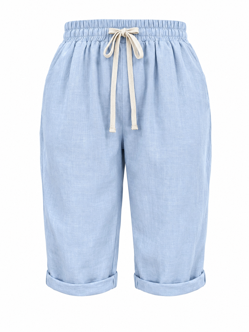 Lightweight women’s summer Capri pants by FJØRNA with relaxed fit, drawstring waist, and breathable fabric for comfort.