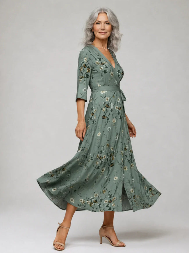 FJØRNA elegant floral maxi dress for women with halter neck and sleeveless design, perfect for summer or special occasions.