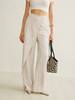 Lightweight women's summer trousers by FJØRNA with high waist and wide-leg wrap design, shown in a natural fabric and relaxed fit.