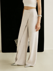 FJØRNA lightweight summer women's trousers with high waist and wide-leg wrap design, styled for warm weather comfort.