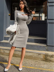 FJØRNA chest zipper cut-out midi dress displayed on a model, featuring a fitted silhouette and stylish cut-out details at the chest.