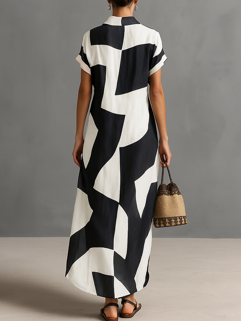 Elegant navy chiffon maxi dress for women by FJØRNA, flowing fabric with a fitted bodice and full-length skirt.