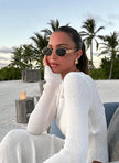 FJØRNA Retro Studio sunglasses with classic round frames and tinted lenses, stylish accessory for fashion-forward outfits.