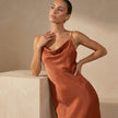 Close-up of FJØRNA slim fit sleeveless maxi dress with cowl neck, showing soft fabric and elegant design details.