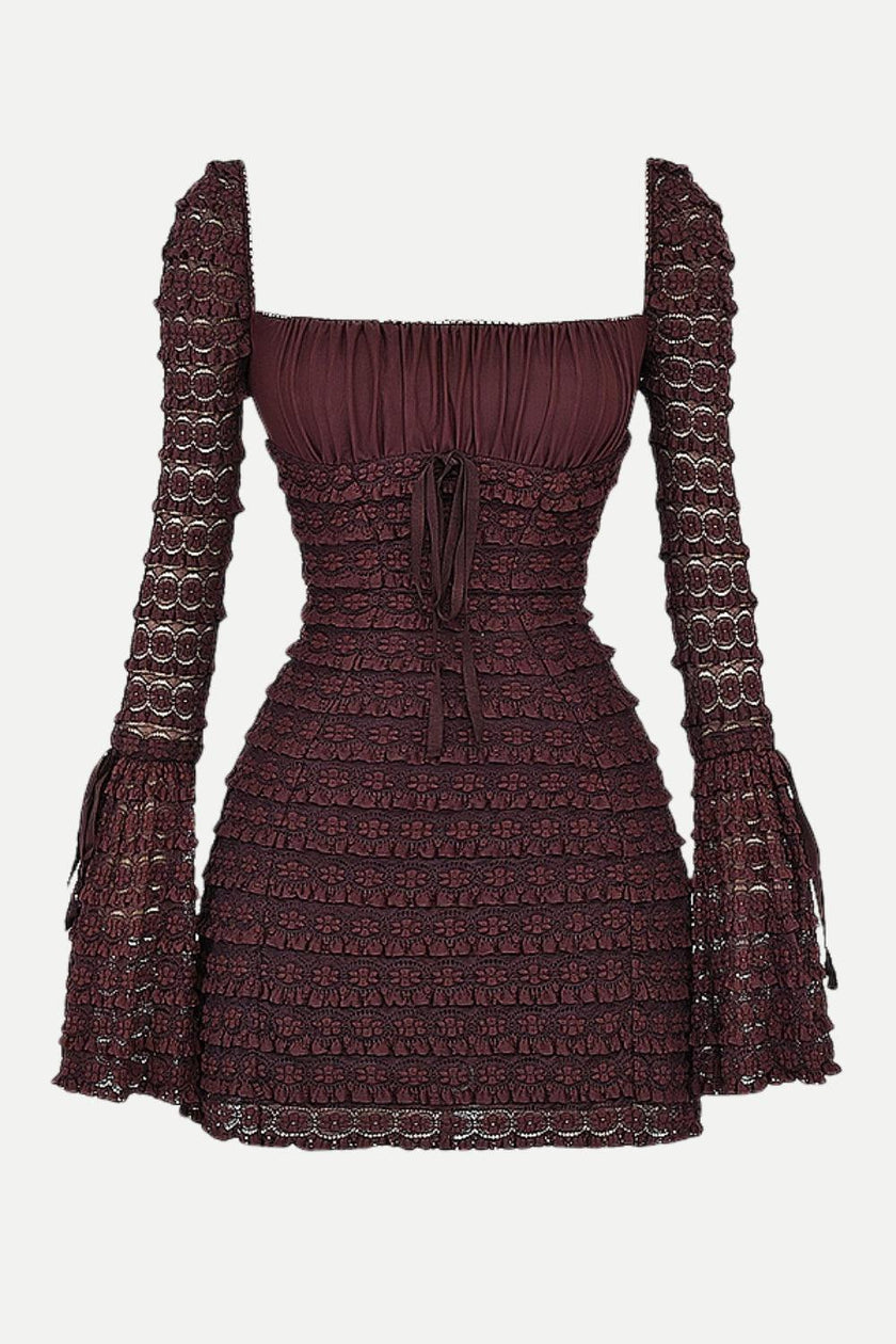 FJØRNA coffee-colored ruched mini dress displayed on a hanger, showcasing its fitted silhouette and textured fabric.