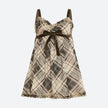 FJØRNA Coquette plaid mini dress featuring a fitted silhouette and classic tartan pattern, perfect for casual or semi-formal wear.