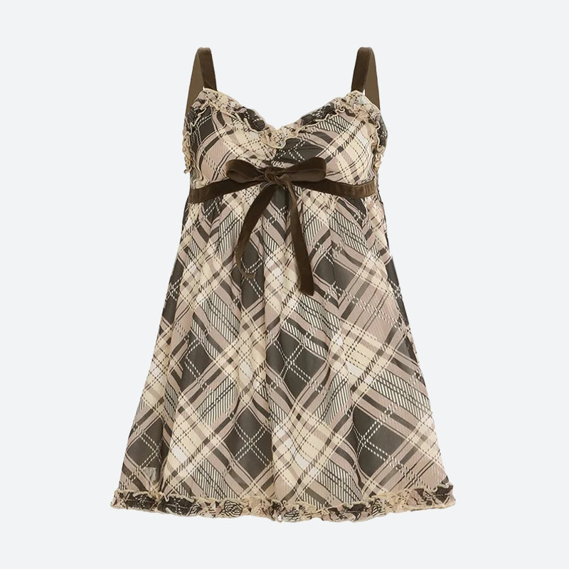 FJØRNA Coquette plaid mini dress featuring a fitted silhouette and classic tartan pattern, perfect for casual or semi-formal wear.