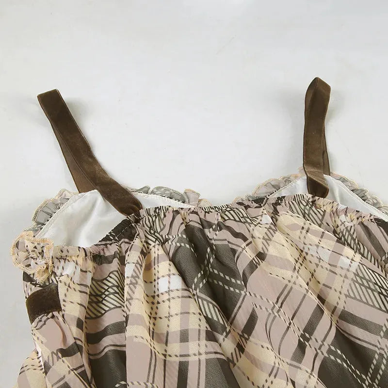 FJØRNA Coquette plaid mini dress featuring a fitted silhouette and stylish pattern, perfect for casual or semi-formal wear.