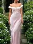 FJØRNA Coquette Princess satin maxi dress with elegant flowing design, featuring a fitted bodice and full-length skirt.