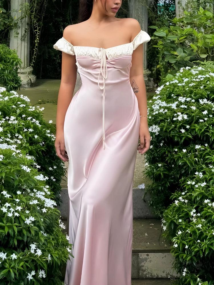 FJØRNA Coquette Princess satin maxi dress with elegant flowing design, featuring a fitted bodice and full-length skirt.
